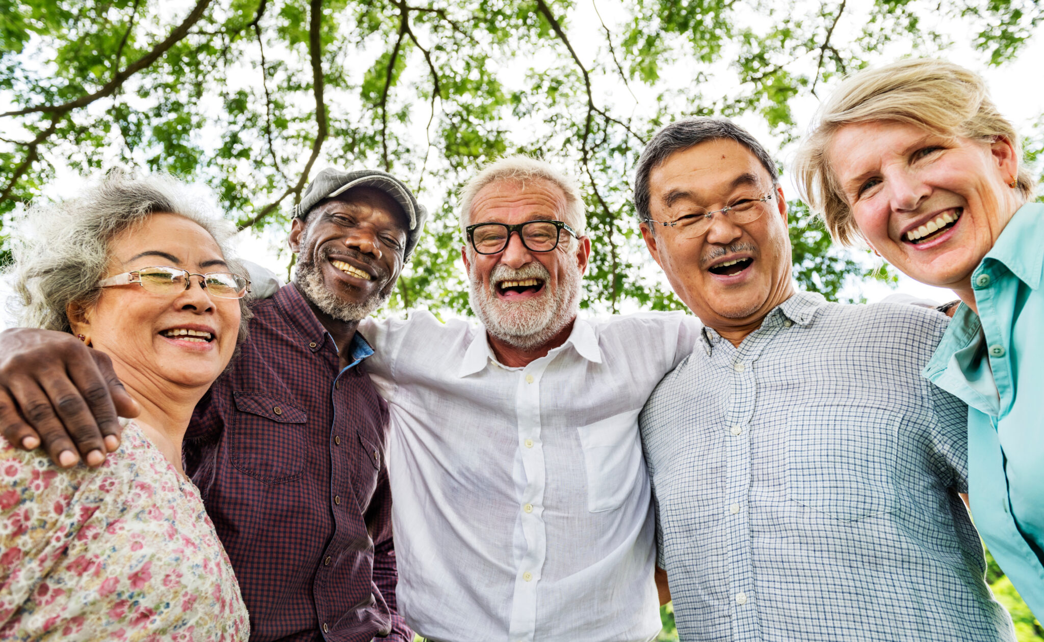 A group of people that are smiling together